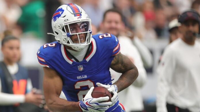 DJ Moore of the Buffalo Bills holding his right shoulder after sustaining an AC joint sprain in Week 2