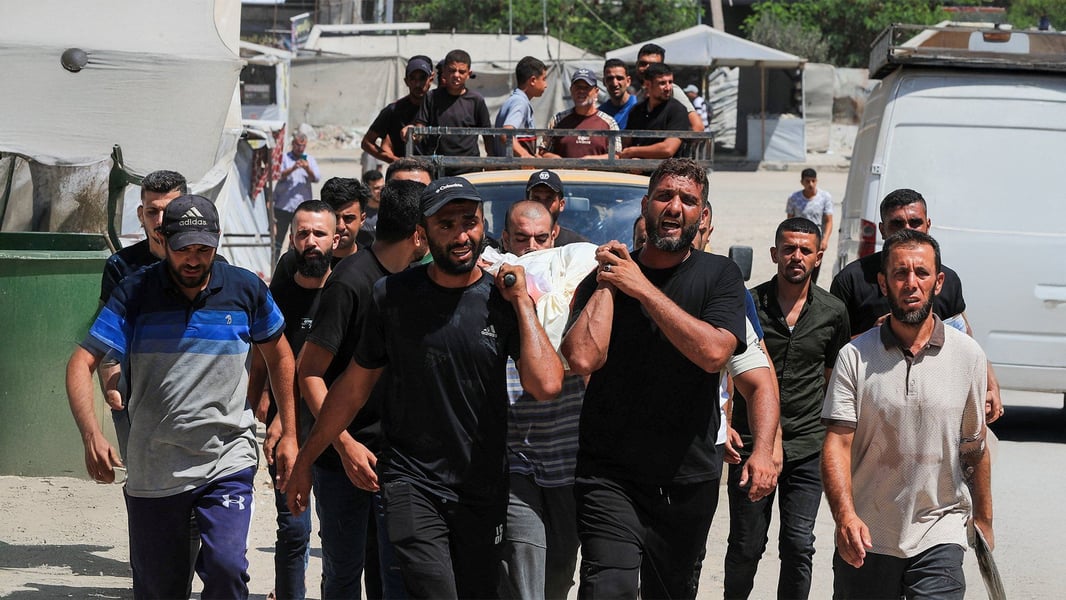 Mourners carry the body of a child killed in an Israeli airstrike in Gaza City, September 2026