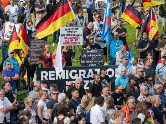 German police escort deportees at airport during deportation flight from Germany