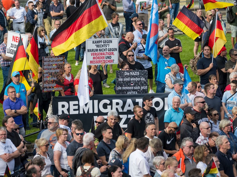 German police escort deportees at airport during deportation flight from Germany