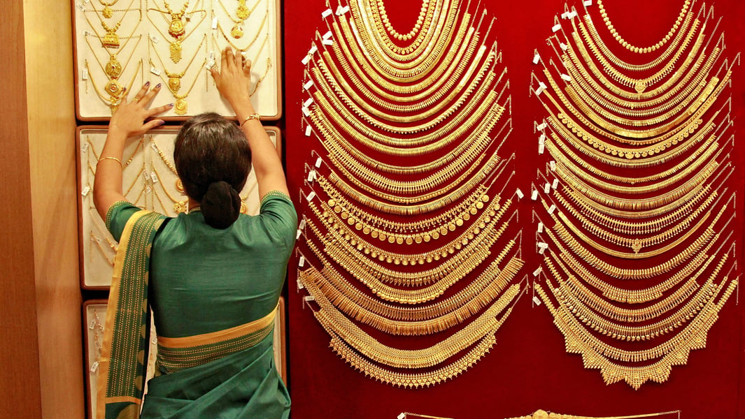Gold bullion bars and coins representing global gold prices ahead of Indian festive season September 2026