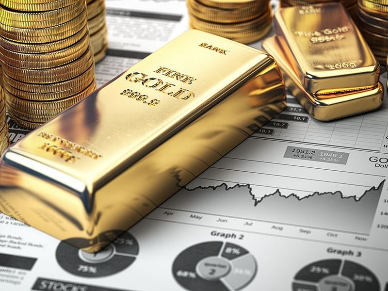 Gold bars gold coins and price chart showing UK gold rate on September 13 2026