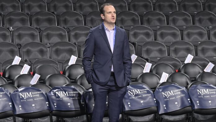 Atlanta Hawks front office executives Tim Bontemps and Peter Dinwiddie with team president Onsi Saleh