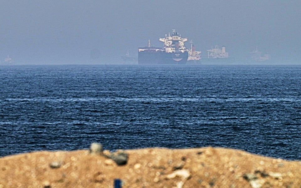 Cargo ships passing through the Strait of Hormuz near Khor Fakkan, United Arab Emirates, 2026