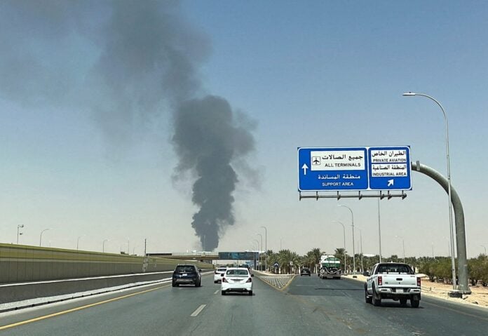 Black smoke rises from an Aramco fuel depot near King Khalid International Airport in Riyadh after a Houthi ballistic missile attack