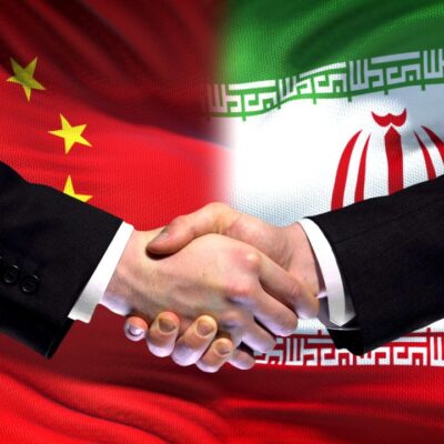 Chinese and Iranian flags representing Iran's ChuXin financial mechanism bypassing US sanctions in 2026
