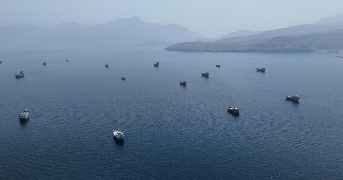 Ships near the Strait of Hormuz as Iran threatens a restricted maritime zone driving Brent crude above $97 a barrel