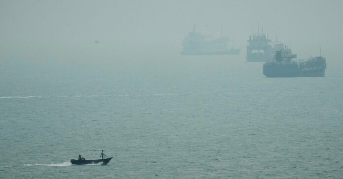 Tankers waiting to transit the Strait of Hormuz as the US-Iran tanker war blocks shipping lanes