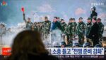 Kim Jong Un at podium pledging North Korea support for Russia alliance