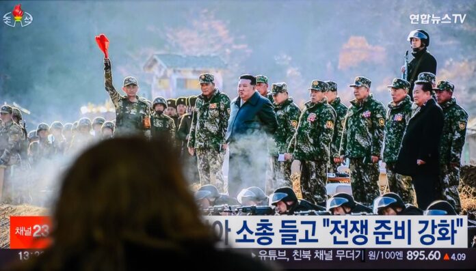 Kim Jong Un at podium pledging North Korea support for Russia alliance