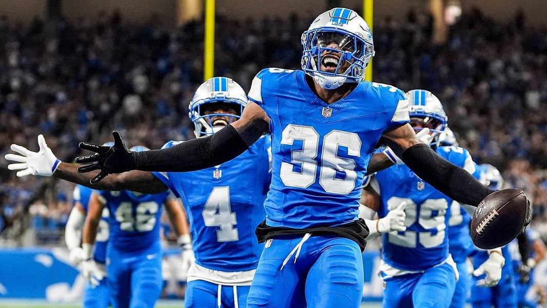 Detroit Lions players celebrate after their 31-30 overtime victory over the New Orleans Saints in NFL Week 1 2026 at Ford Field