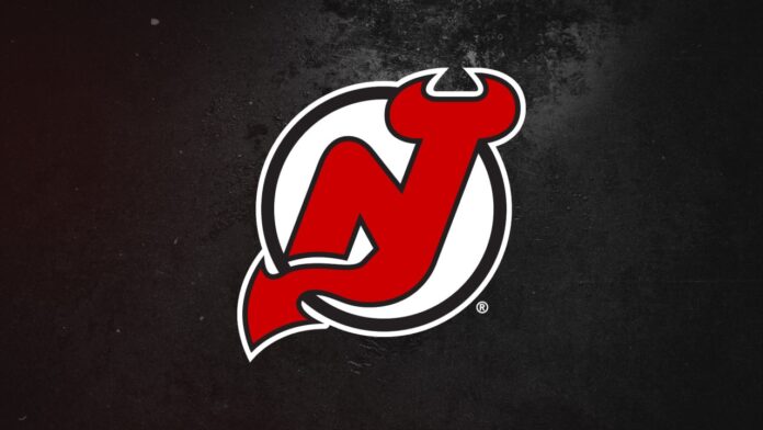 New Jersey Devils logo as Luke Hughes approaches the September 15 CBA extension deadline