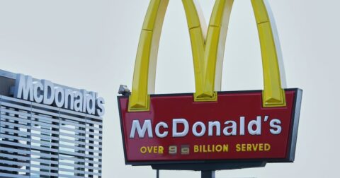 McDonald's restaurant exterior with stock price chart showing 4.28% decline on September 23 2026