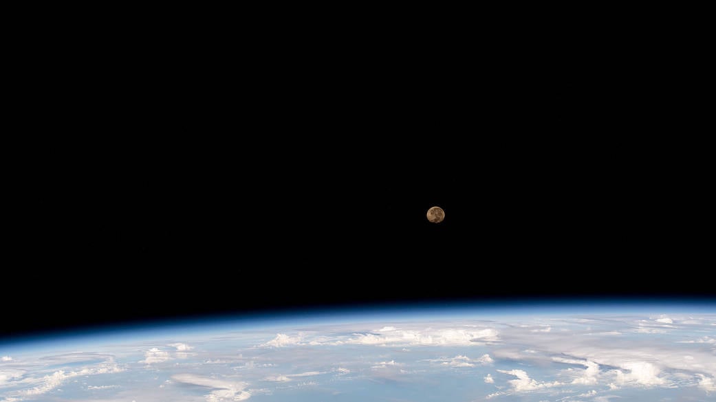 Waning gibbous moon above Earth's horizon photographed from the International Space Station, June 2023