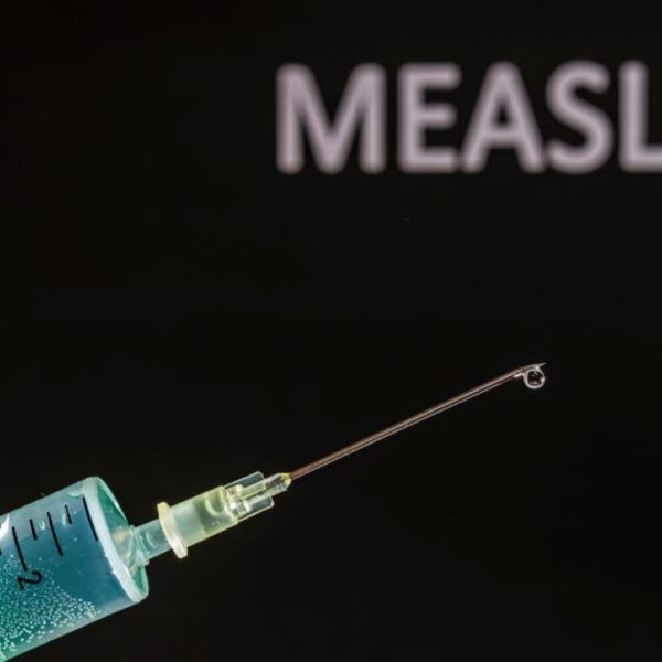 Medical professional administering a vaccine injection, representing the Pennsylvania measles outbreak that has claimed three lives
