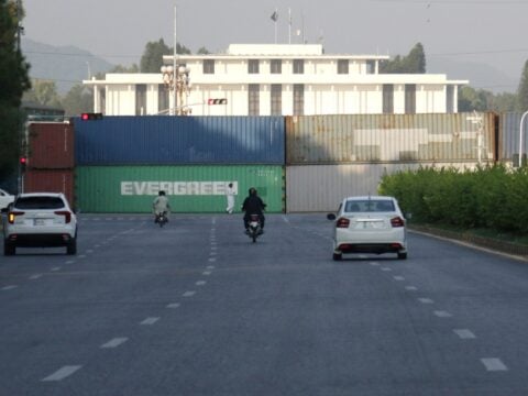 Shipping containers blocking a road into Islamabad ahead of PTI march