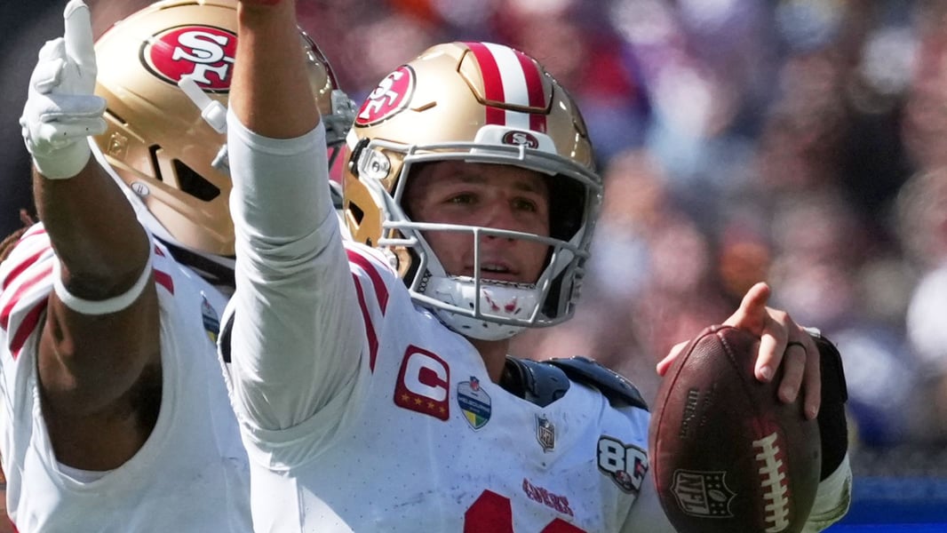Brock Purdy of the San Francisco 49ers celebrates after throwing a touchdown pass at the Melbourne Cricket Ground