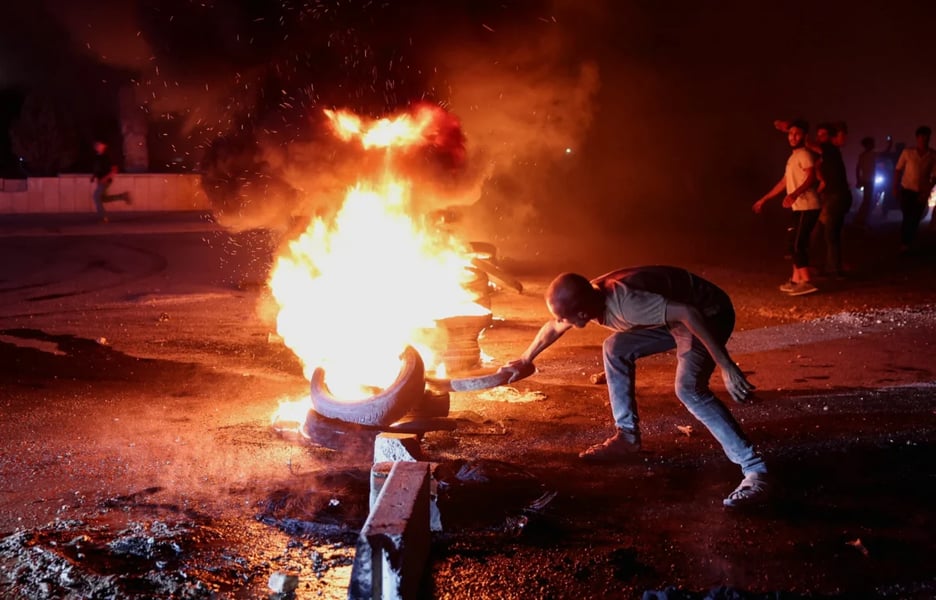 Protesters in Syria during demonstrations over rising fuel prices
