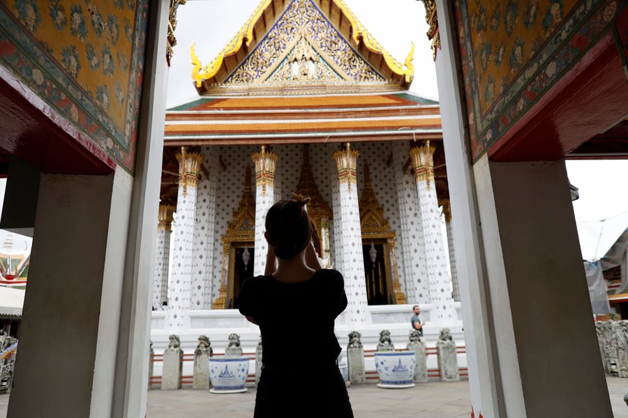 Tourists at a Thai airport check-in counter as Thailand cuts visa-free stay to 30 days