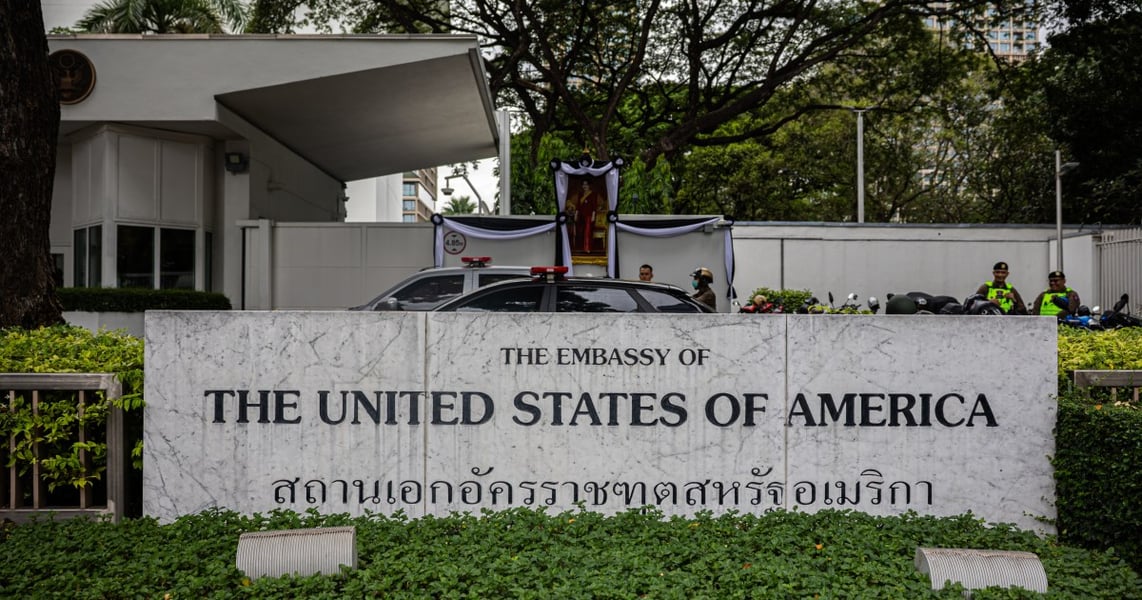 Thai and foreign travelers at a Bangkok immigration checkpoint amid tightening visa rules