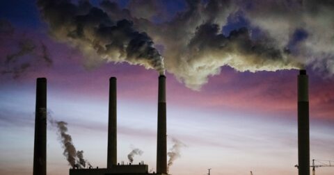 Coal-fired power plant smokestacks emitting smoke in the United States