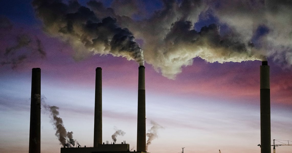 Coal-fired power plant smokestacks emitting smoke in the United States