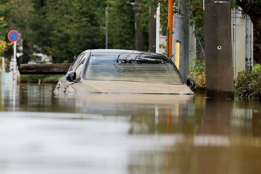 Search and rescue teams responding to Typhoon Dujuan landslides in Japan