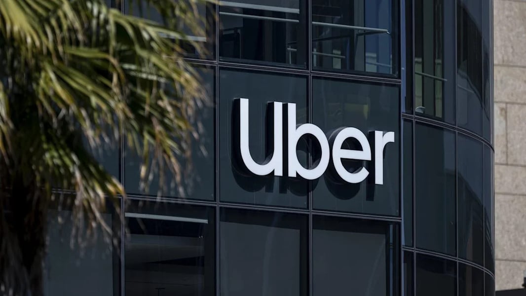 Uber headquarters sign amid 3300 layoffs targeting middle management and remote workers