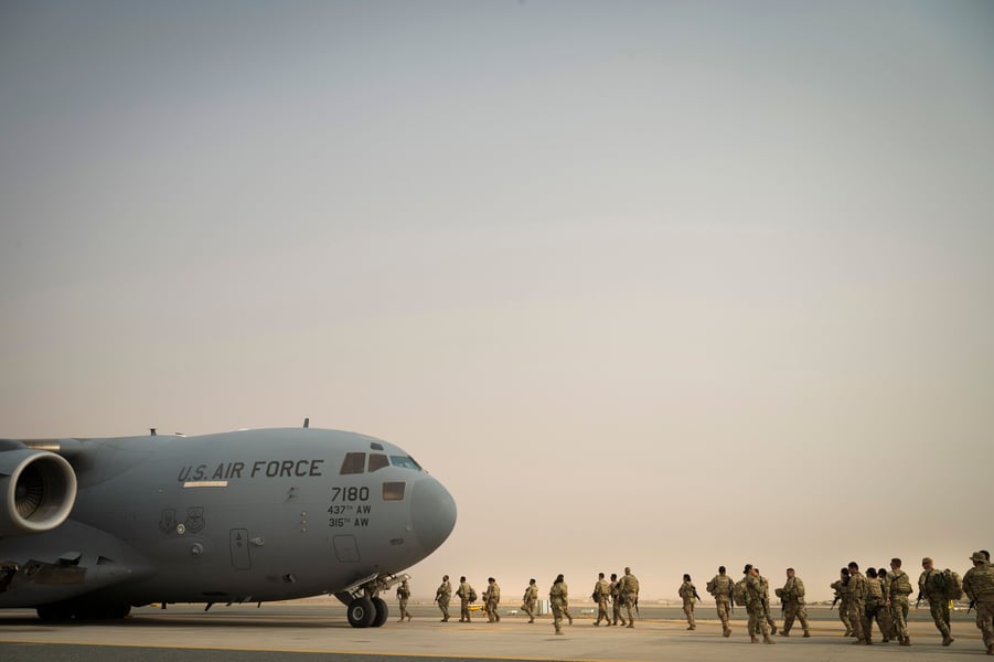 US Air Force troops boarding a C-17 transport aircraft at a Gulf air base amid the Iran war
