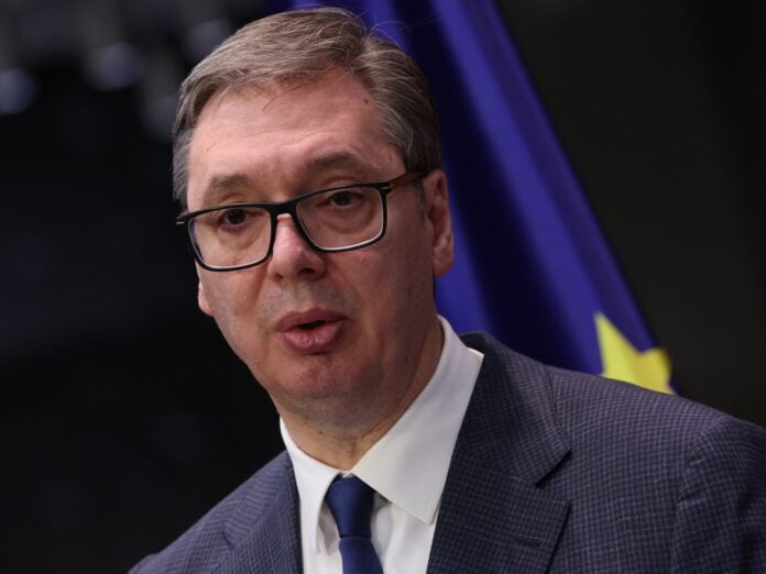 Serbian President Aleksandar Vucic signs the decree dissolving parliament ahead of October 25 snap elections