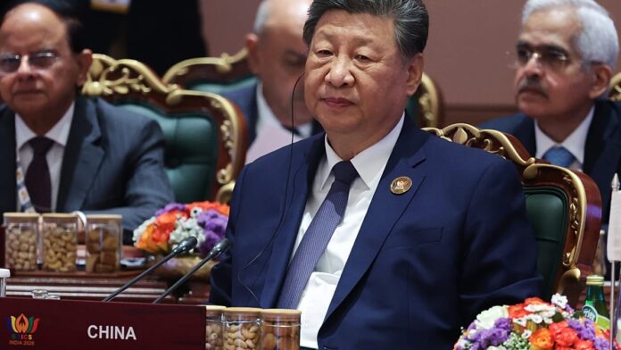 Xi Jinping speaking at the 18th BRICS Summit in New Delhi, India, proposing an open-source AI community