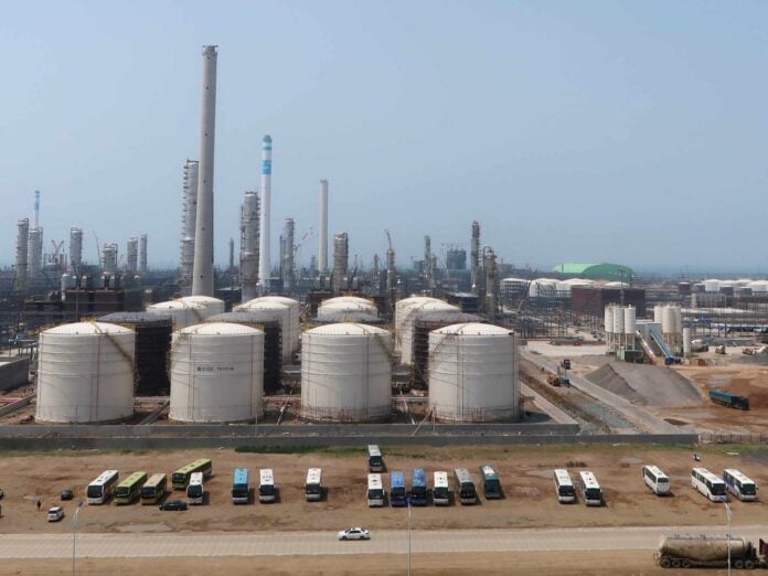 Oil storage tanks representing China's Iranian crude oil supply chain at the center of the Xi-Trump White House summit agenda