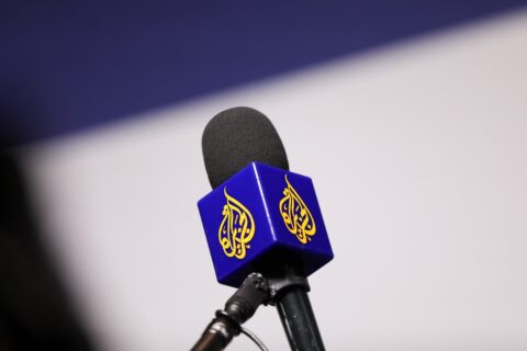 A microphone fitted with the Al Jazeera logo