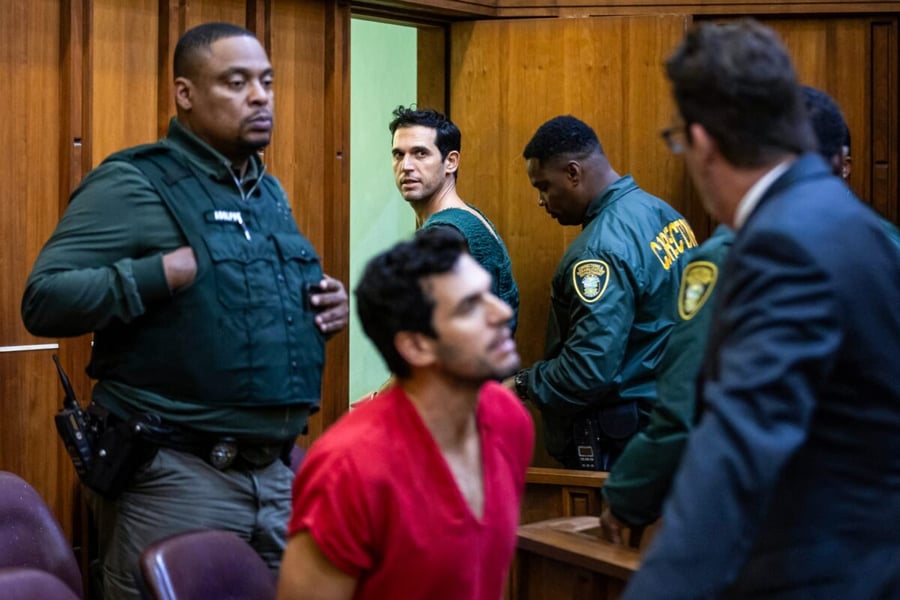 Oren and Alon Alexander in a Miami courtroom surrounded by corrections officers at their December 2024 bond hearing