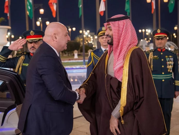 Lebanese President Joseph Aoun shakes hands with Saudi Crown Prince Mohammed bin Salman during a reception in Riyadh
