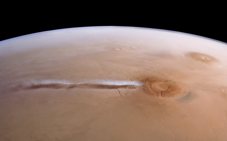Mars Express view of the Arsia Mons Elongated Cloud stretching from a volcano across the Martian horizon
