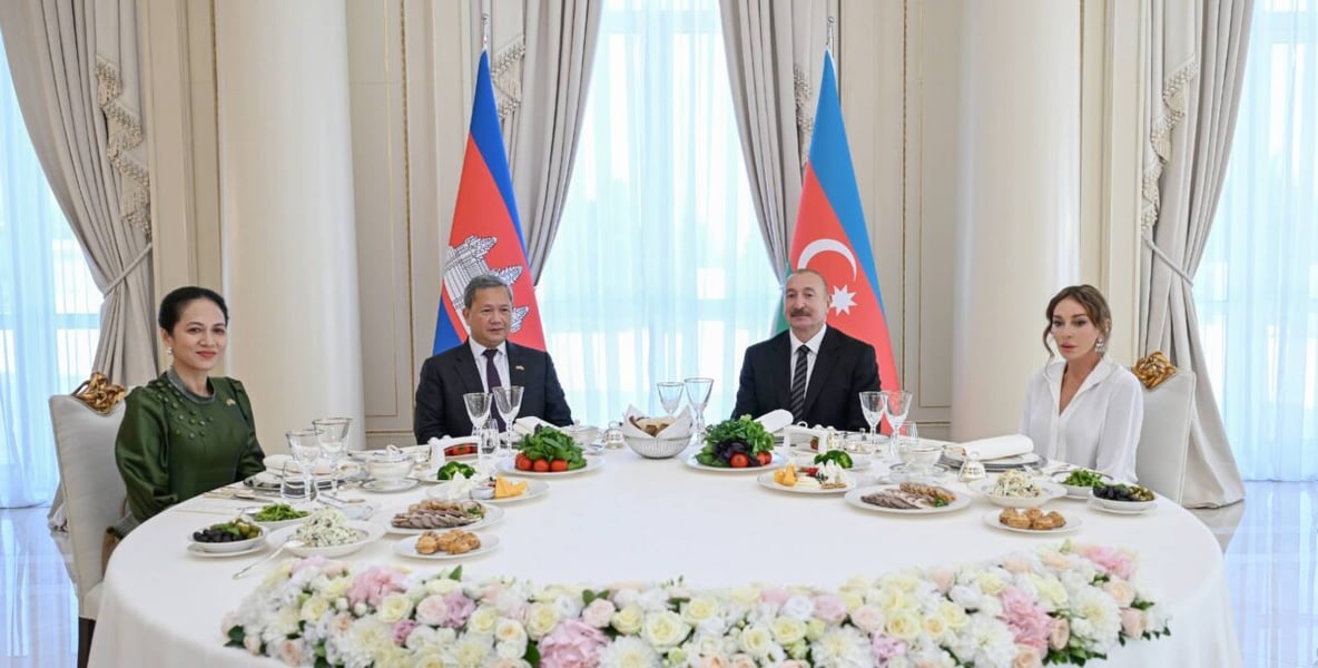 Azerbaijan's President Ilham Aliyev and Cambodia's Prime Minister Hun Manet seated with their wives at an official luncheon in Baku