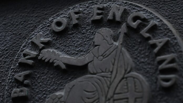 Close-up of the Bank of England emblem, showing the bank's name around the figure of Britannia