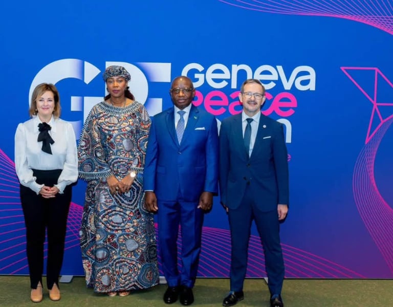Sierra Leone's President Julius Maada Bio stands with other delegates in front of a Geneva Peace Forum backdrop