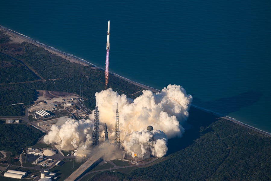 Blue Origin's New Glenn rocket climbing away from Launch Complex 36 at Cape Canaveral Space Force Station in a cloud of exhaust