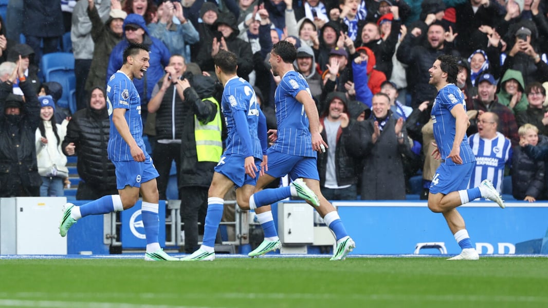 Brighton players run in celebration in front of cheering home supporters at the Amex during the win over Crystal Palace