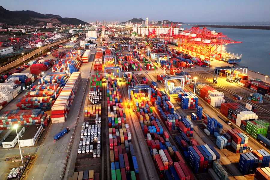 Aerial view of stacked shipping containers and cranes at Lianyungang Port in Jiangsu Province, China