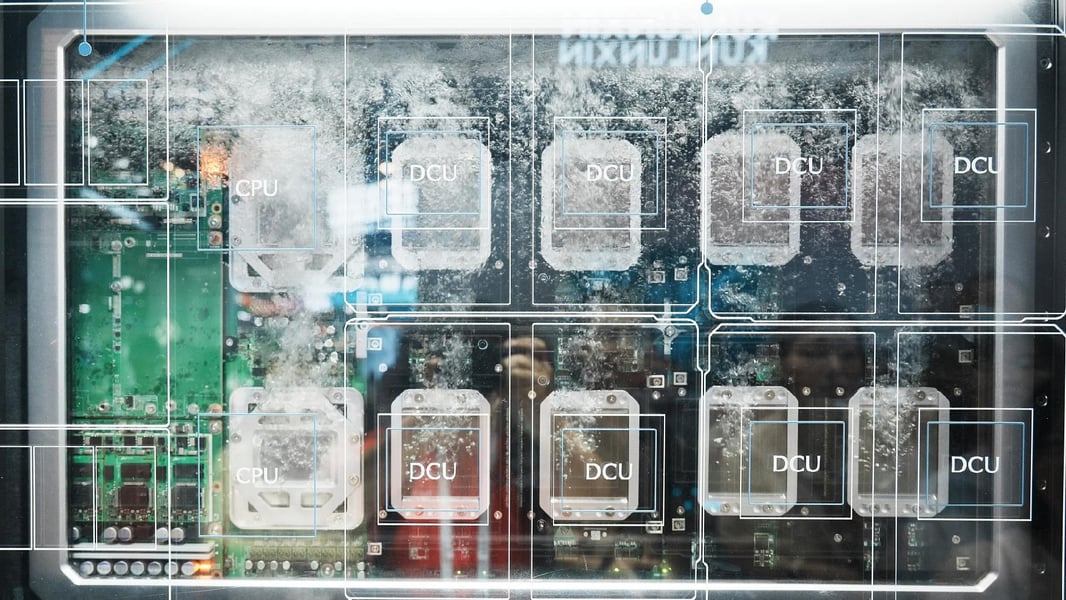 Liquid-cooled server board with CPU and DCU chips submerged in coolant at the World AI Conference in Shanghai