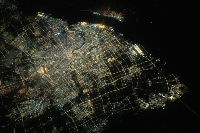 Aerial night view of Shanghai's city lights and the Huangpu River photographed from the International Space Station