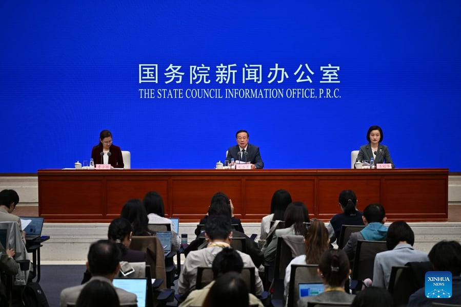 Officials at a State Council Information Office press conference in Beijing on China's economic performance in the first three quarters of 2026