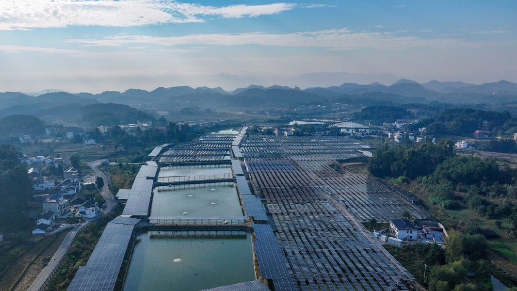 Aerial view of solar panels covering fish ponds at a hatchery in Maopo Village, Guizhou Province, China