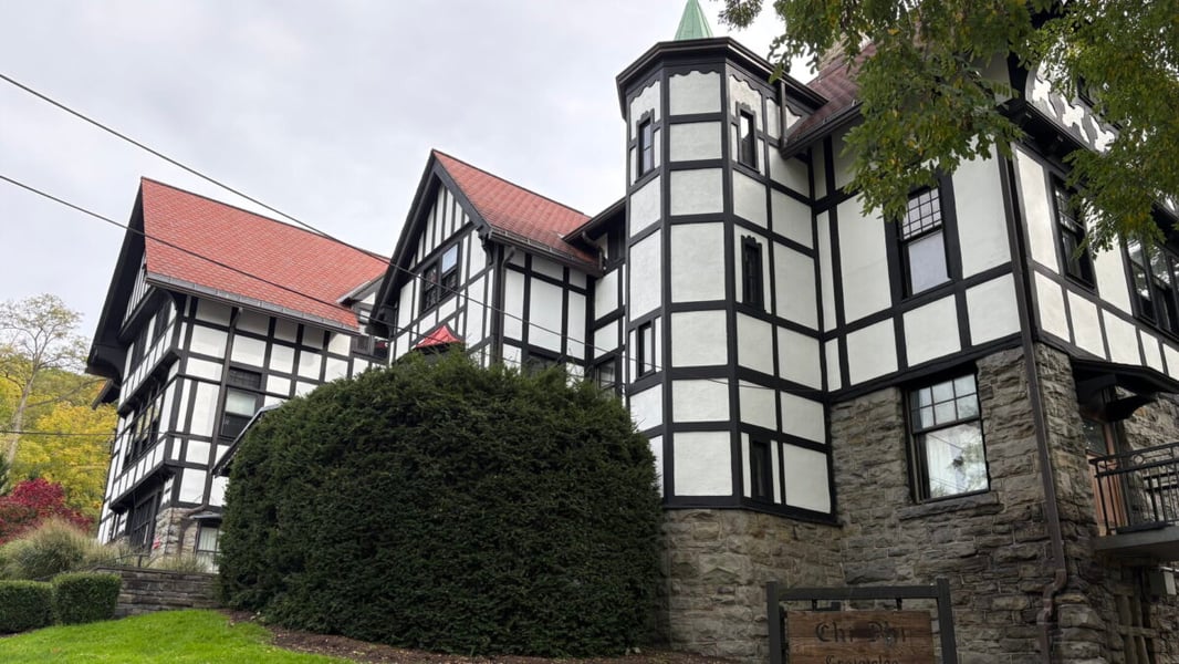 A fraternity house with a Chi Phi sign near the Cornell University campus in Ithaca