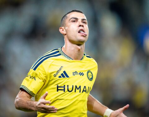 Cristiano Ronaldo in a yellow Al Nassr shirt reacting during a Roshn Saudi League match