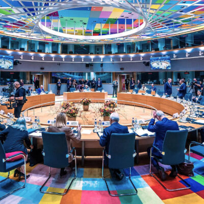 EU leaders' negotiating room at the Europa building in Brussels during the October 15 summit, with a round table under a colourful ceiling
