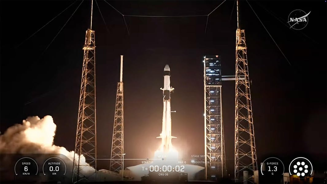 A Falcon 9 rocket lifting off from Space Launch Complex 40 at night with the NASA logo and launch telemetry overlay